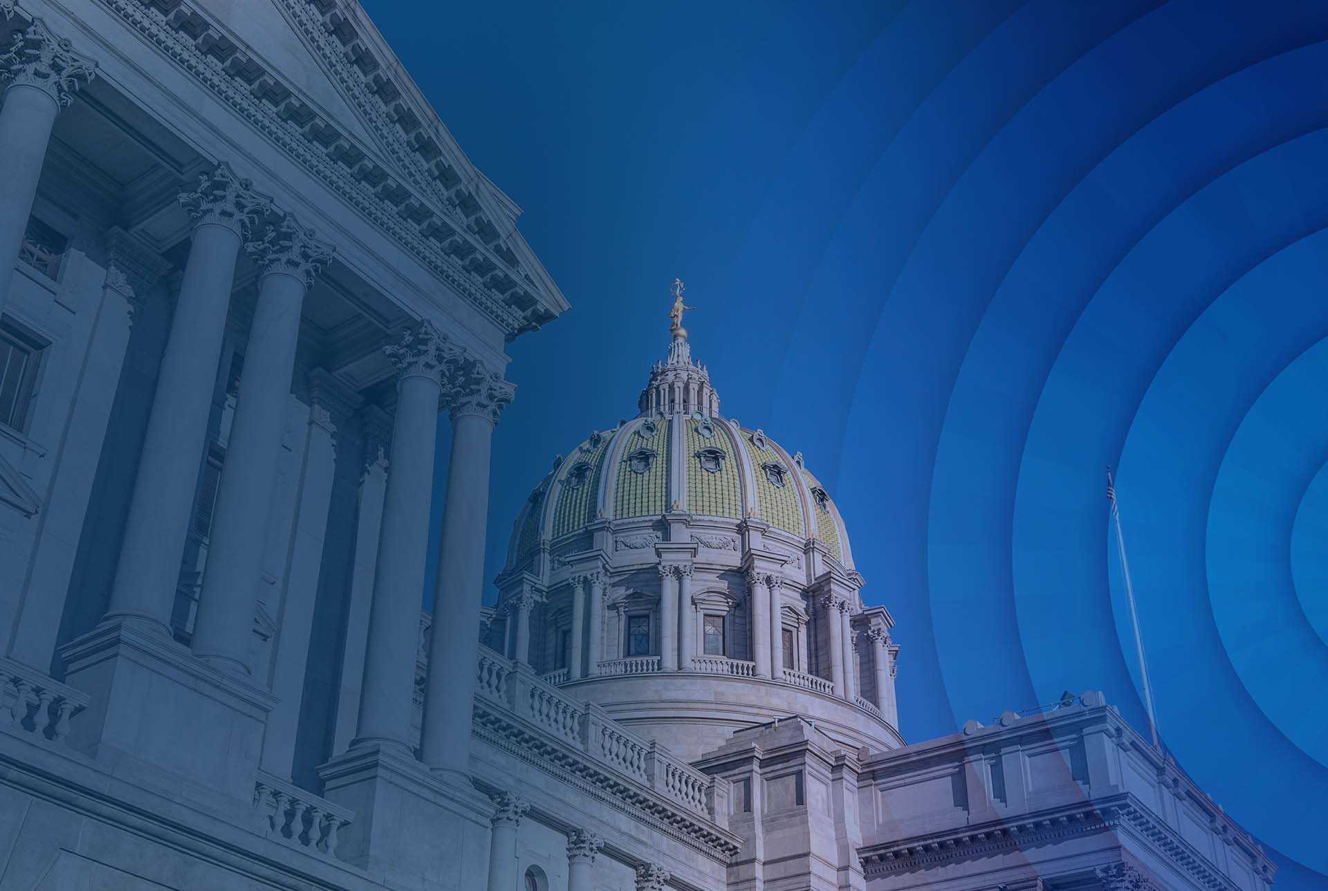 Exterior view of a grand neoclassical building with a domed roof and columns, overlaid with blue concentric circles, creating a modern, serene tone.