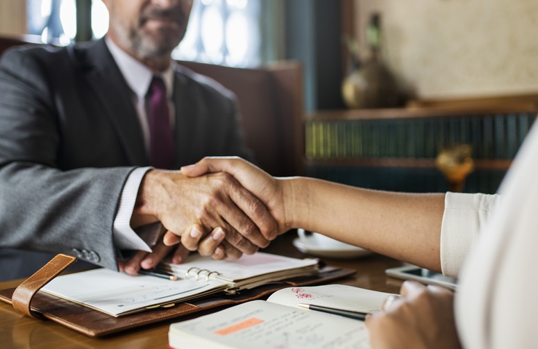 Lawyer and client shaking hands