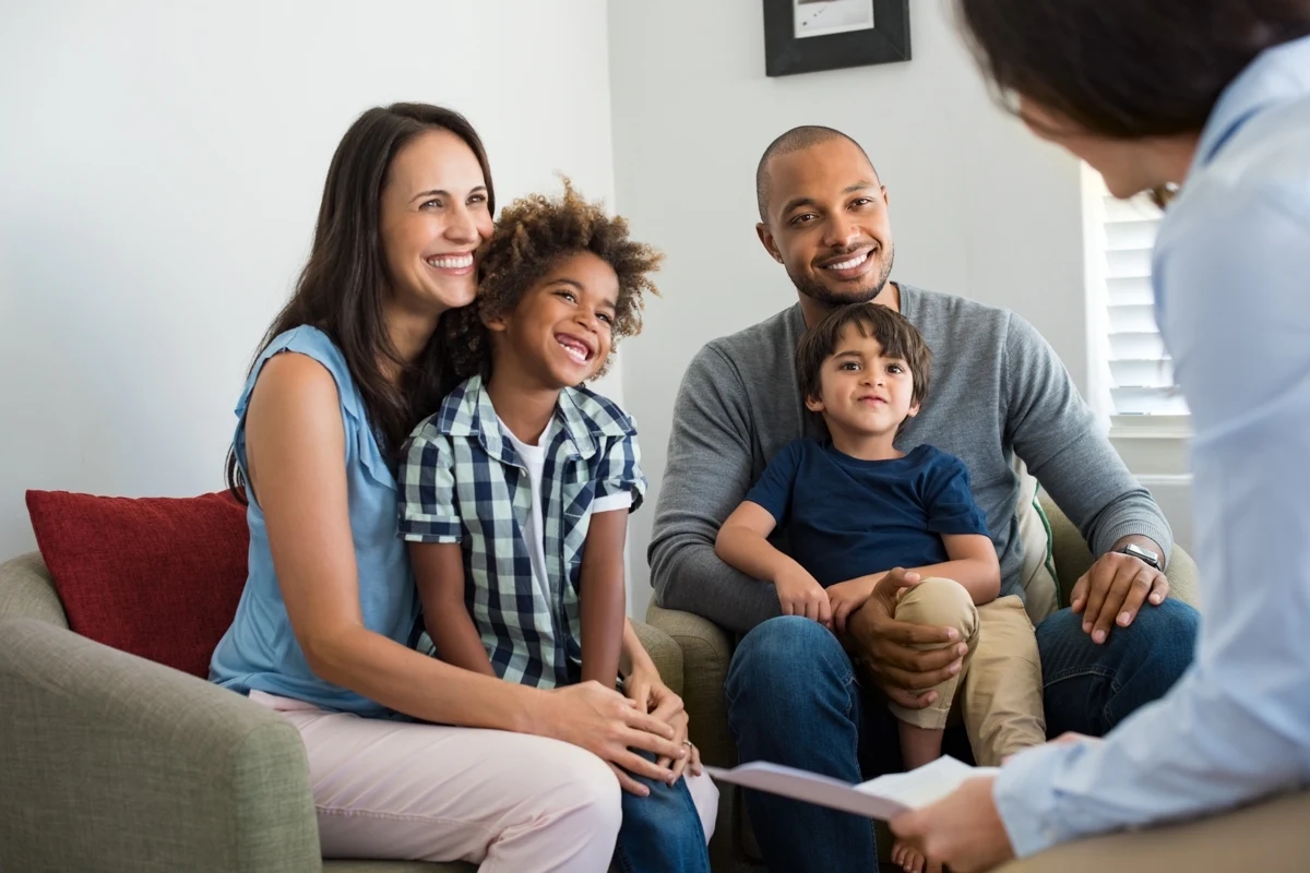 A family engaging with a professional counselor